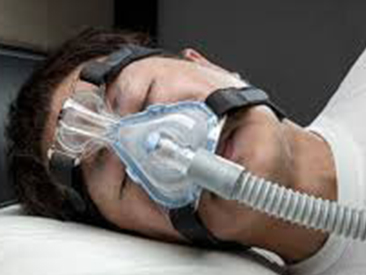 A CPAP device in use on a patient.